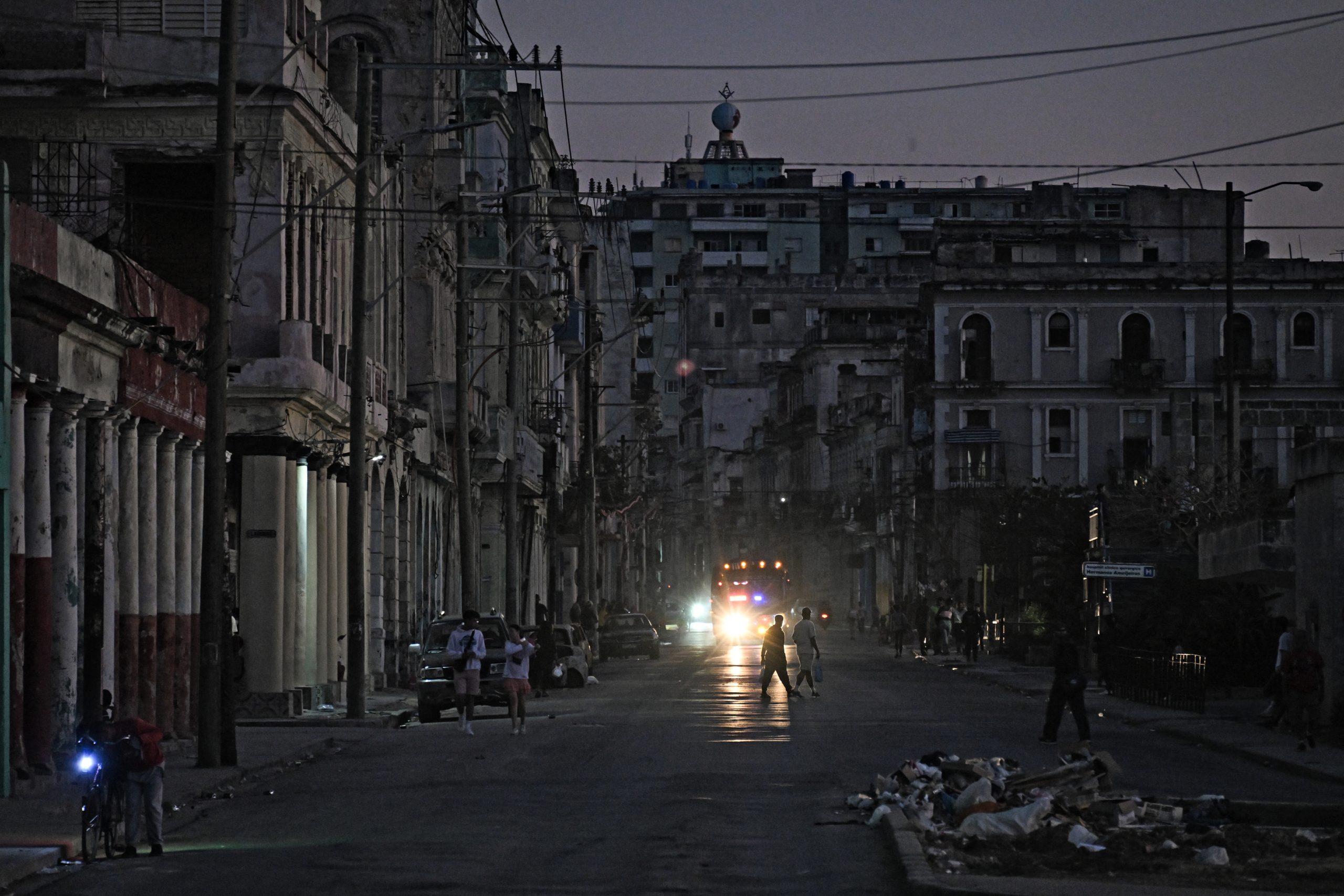 People walk down a street during a blackout in Havana on February 21, 2026.
