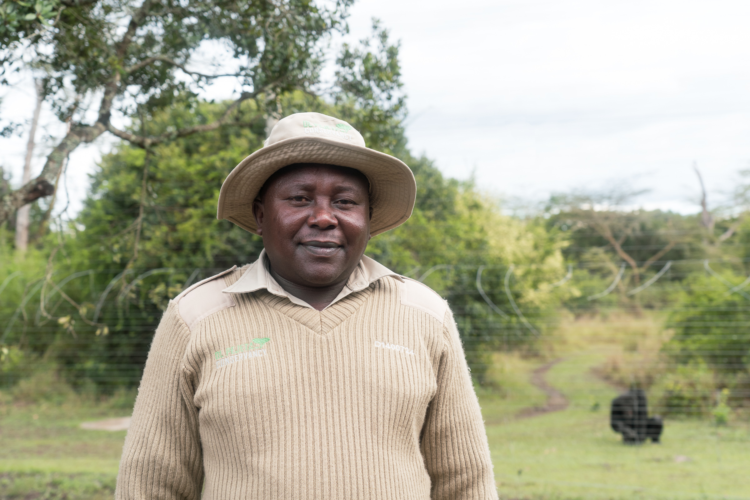 Martin Kinyua, 45, has worked at Sweetwaters since 2000. His favorite chimpanzee is Alley — "the engineer" — who has tried to bite others after her breakouts but, he says, has never turned on him. Photo by Jaclynn Ashly.
